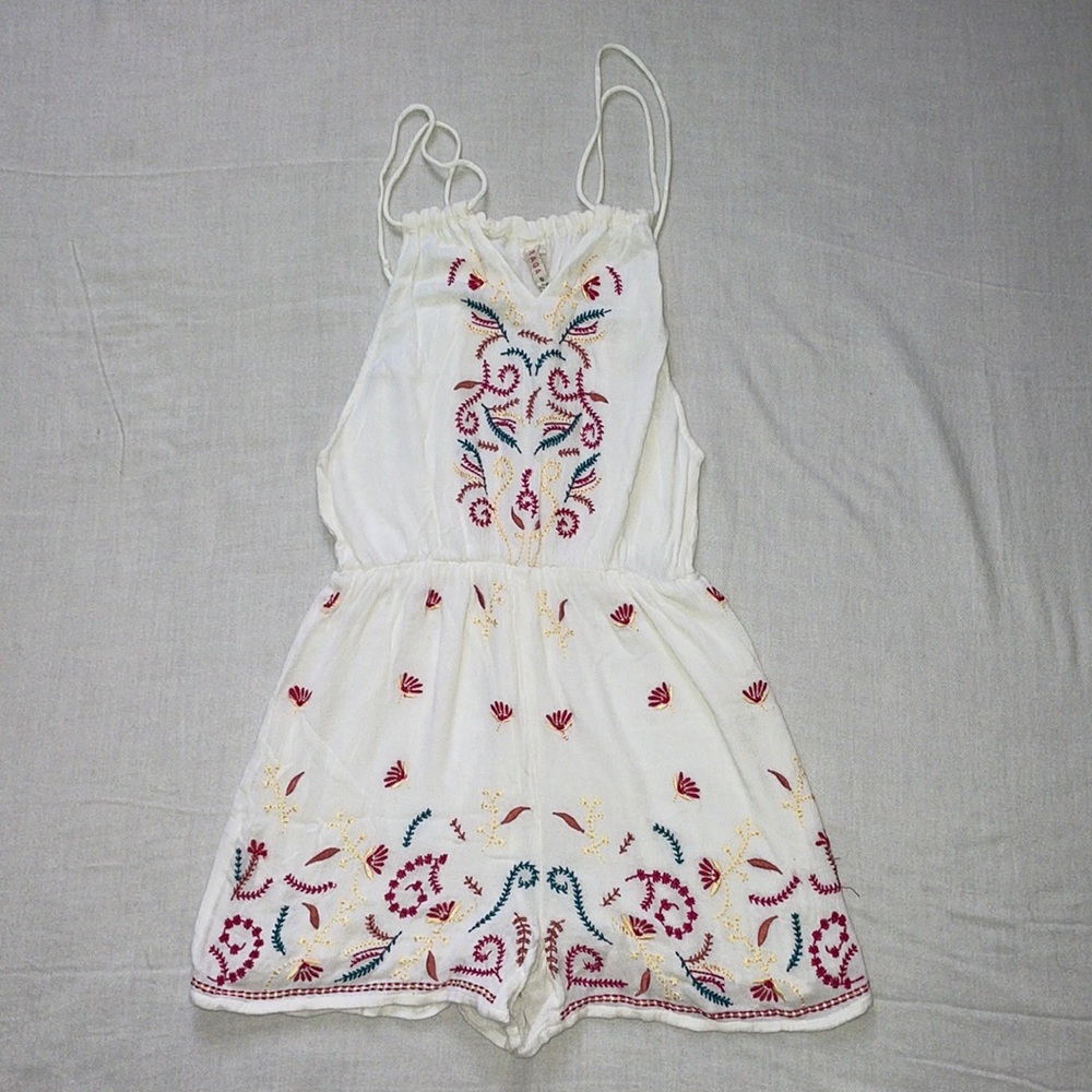white romper w/ colorful detailing